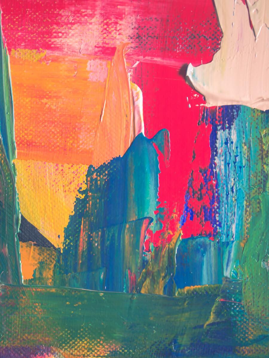 Abstract painting with large strokes of bright red, orange, and blue