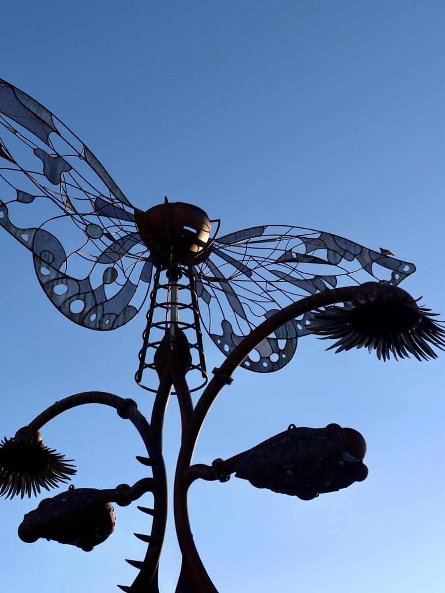Large metal art piece in the shape of a butterfly