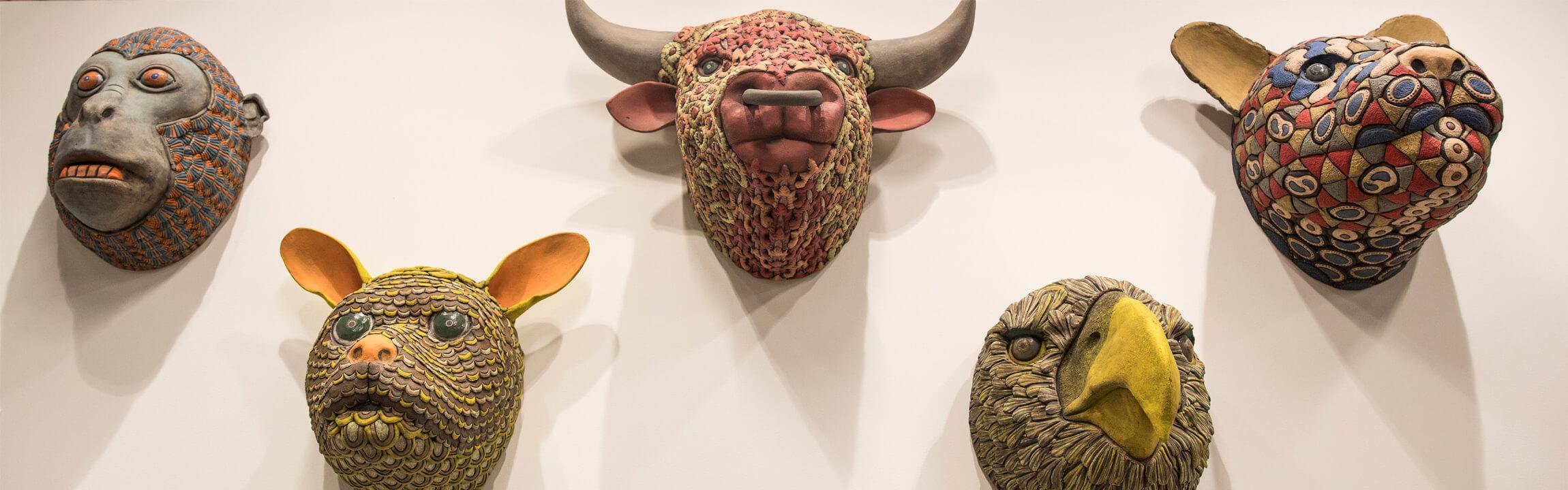 ceramic masks of animals by artist George Rodriguez