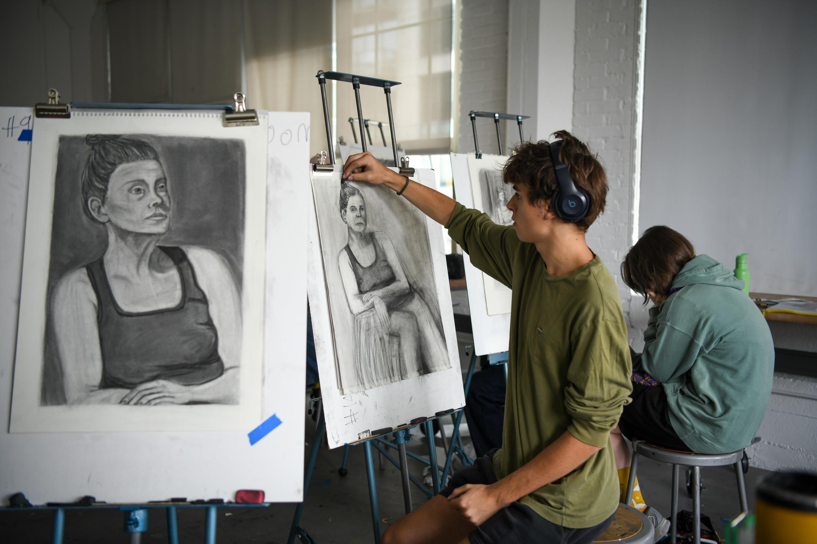 Photo by Winnie Westergard from Summer@Cornish 2025; arts students drawing on easel.