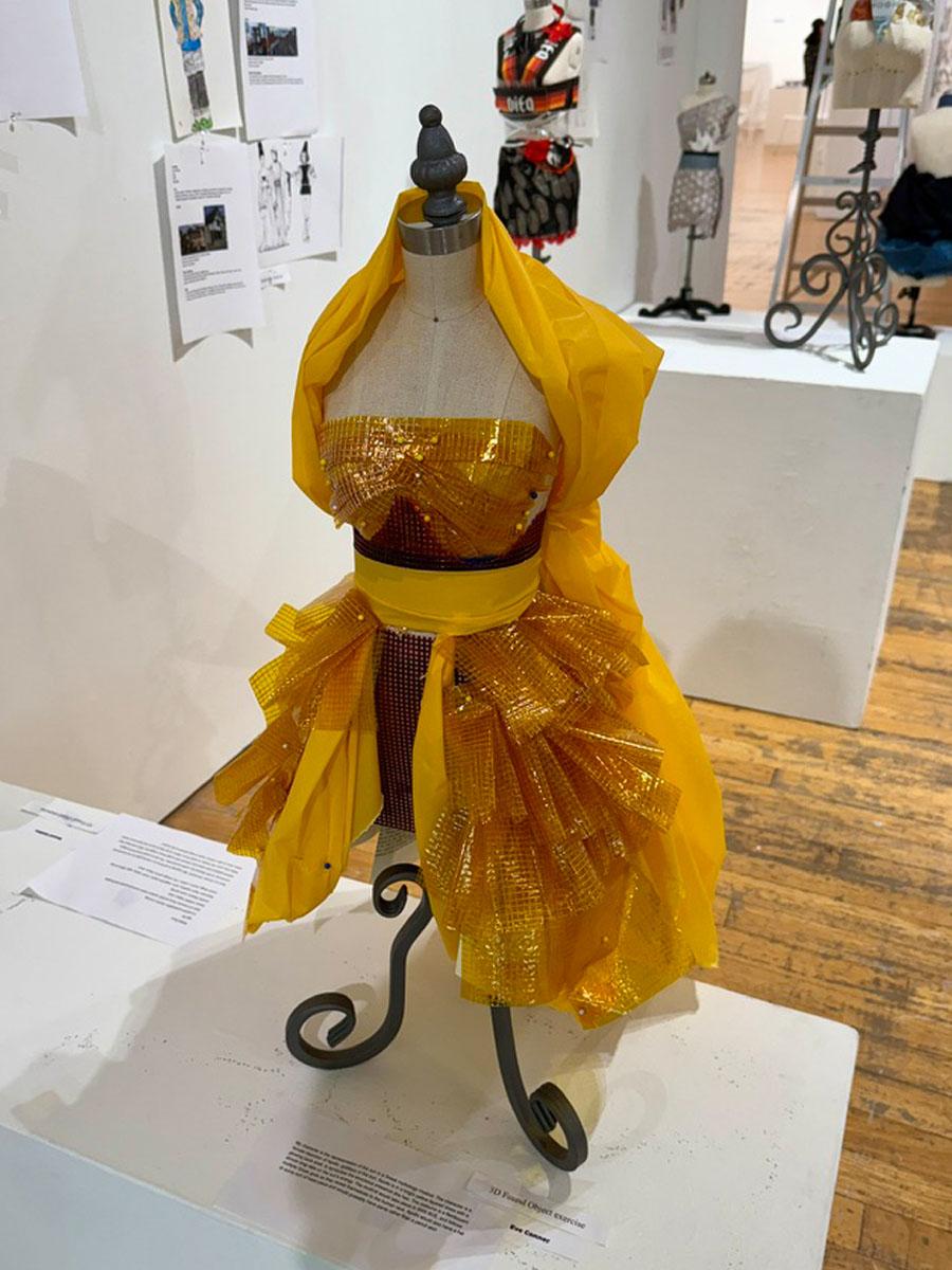 yellow costume on a small design form for costumes in a gallery yellow dress
