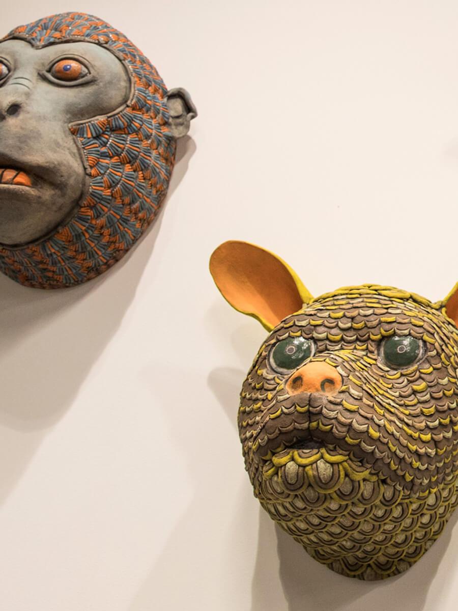 ceramic masks of animals by artist George Rodriguez