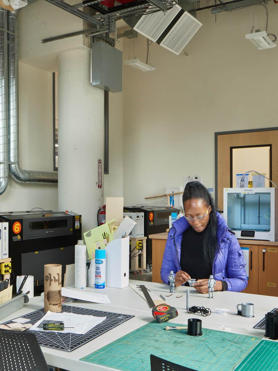 black woman working in 3D print lab