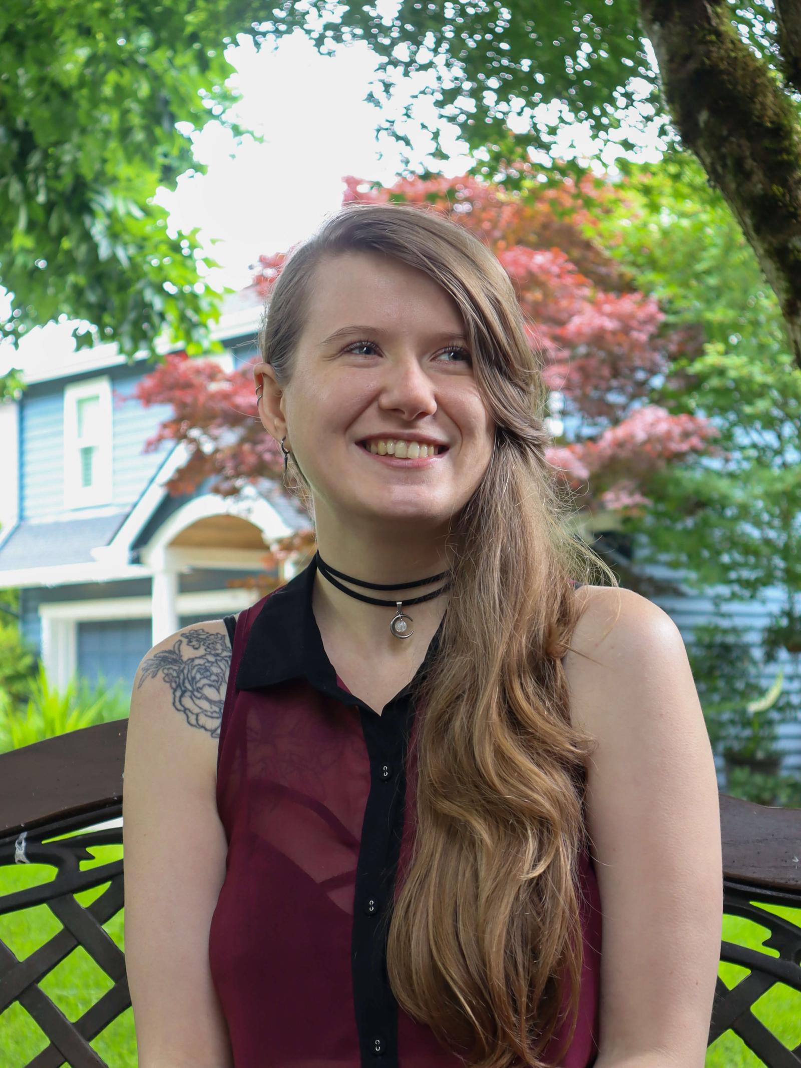 Sage Casias-Abplanalp in a red tank top smiling