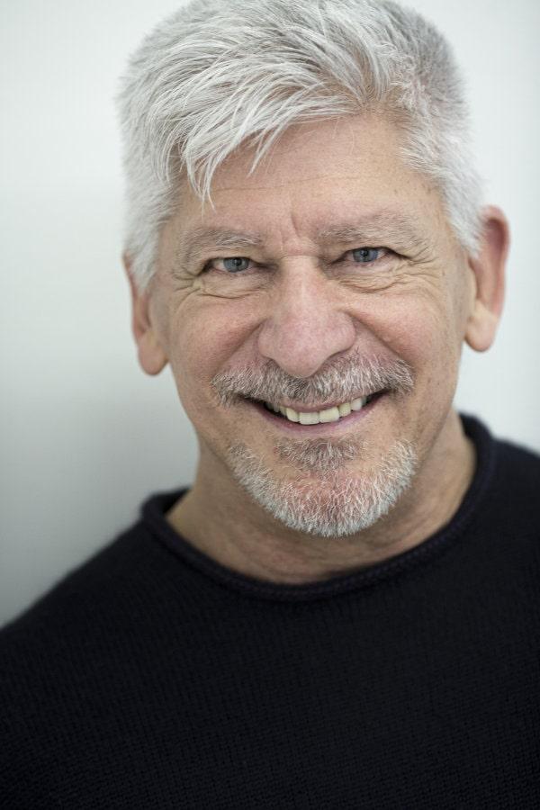 Davit Taft black shirt grey hair beard