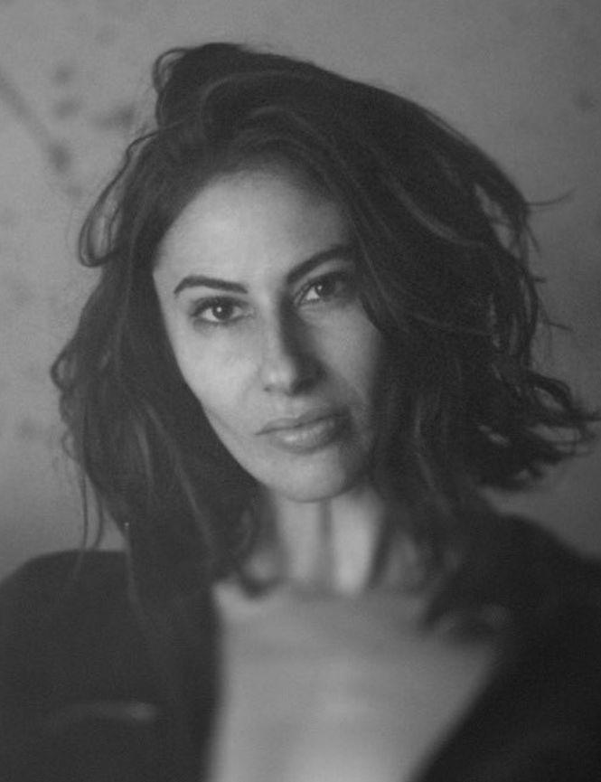 Hannah Simmons black and white photo with brown hair and sweater