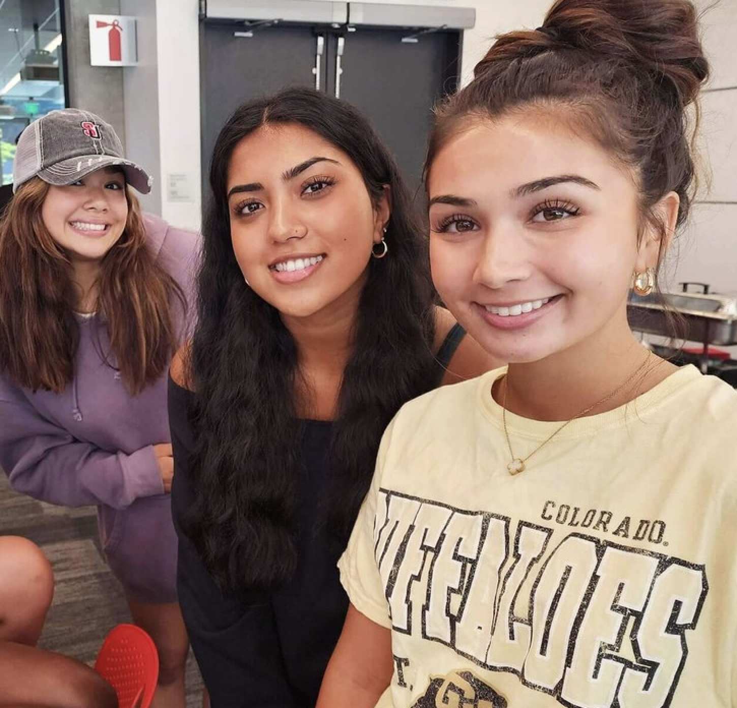 Business students posing for photos in colorful clothing smiling 