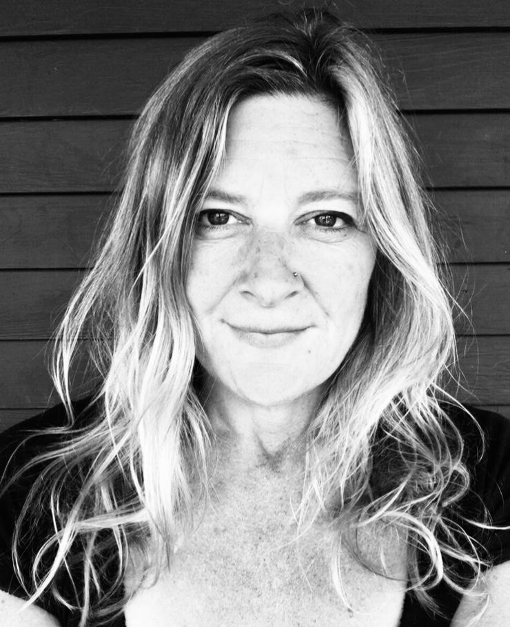 Jodi Rockwell headshot with a black and white photo and long blond hair